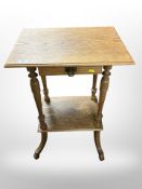 An early-20th century oak occasional table fitted a drawer, 52cm wide.
