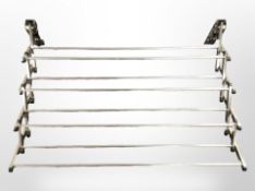 A chrome concertina wall-mounted drying rack, width 87cm.