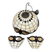 A Tiffany-style glass light shade, diameter 48.5cm, together with a pair of matching wall lights.