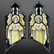 A pair of Angels, two trapezoidal stained, painted and leaded glass windows with ogee pediments,