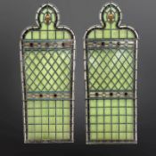 A pair of lancet windows, clear and pale green stained-glass,
