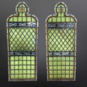 A pair of lancet windows, pale blue and green-stained glass,