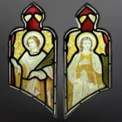 A pair of Angels holding palm branches, symbolising martyrdom, two trapezoidal stained,