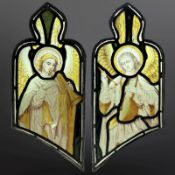 A pair of Angel Musicians, a trumpeteer and a drummer, two trapezoidal green-stained,