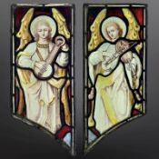 A pair of Angel Musicians, a lutenist and a violinist, two trapezoidal stained,