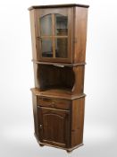 A contemporary pine corner cabinet,