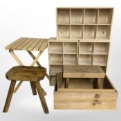 Two pine stools, a folding lattice table, and a group of pine open shelves and boxes.