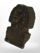 A carved folding Black Forest pocket watch stand.