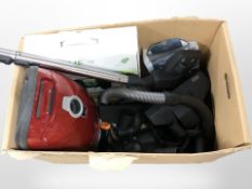 A Miele vacuum cleaner and various attachments.