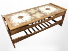A rectangular teak coffee table, with under shelf,