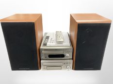 A Denon two-piece Hi-Fi system with instructions, remote, and a pair of Mordaunt-Short speakers.