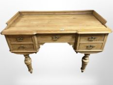 An early 20th century continental pine five drawer wash stand,