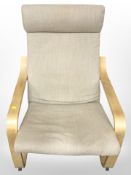 A contemporary Scandinavian armchair in oatmeal fabric width 68 cm