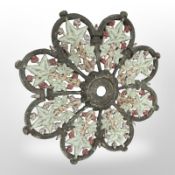 A painted cast iron floral plaque/ceiling rose,
