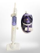 A Tefal steam iron and a further floor steamer.