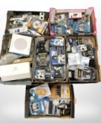A pallet of ex-retail electricals including fibre optic and other cables, TV remote controls,
