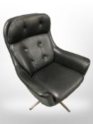 A 20th century Scandinavian black stitched leather swivel armchair,