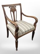 A stained oak armchair in striped fabric, width 60cm.