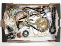 An assortment of costume bead necklaces, gold-plated chains, faux pearls, rosary beads,