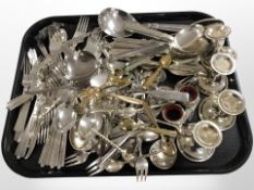 A collection of silver-plated flat wares, dwarf candlesticks, napkin holders, etc.