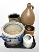 A stone ware wine flagon and several pots.