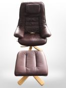 A Scandinavian bent wood and Burgundy leather swivel armchair and footstool