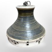A 1970s Scandinavian pottery pendant light fitting, diameter 28cm.
