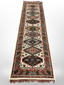A Caucasian design runner, 306cm x 84cm.