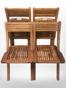 A set of four Milan Collection teak folding garden chairs