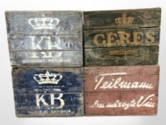 Four vintage continental painted pine bottle crates, each approximately 47cm wide.