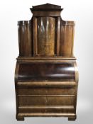 A 19th-century continental mahogany cylinder-front secretaire bureau,
