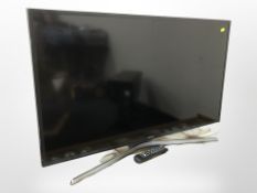 A Samsung 40-inch LCD TV with lead and remote.