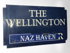 A fibre glass The Wellington pub sign, width 151cm.