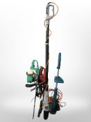 An Einhell electric hedge trimmer, gardenline petrol trimmer,