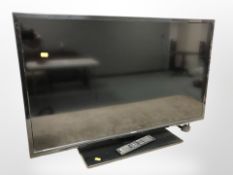 A Polaroid 40 inch LCD TV with lead and remote