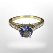 An 18ct yellow gold 0.758ct tanzanite ring set with diamond shoulders, size M/N, 3.3g.
