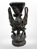 An Tibetan carved hardwood figure of Shiva riding Garuda,