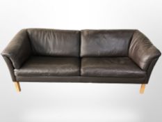 A contemporary Danish brown leather three seater settee,