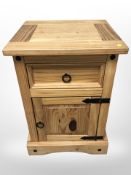 A contemporary pine bedside stand,