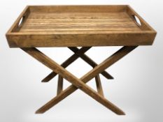 An oak butler's tray table on X-frame stand, width 60cm.