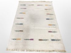 A 1970s flat weave rug on cream ground, 200cm x 135cm.