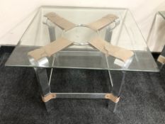A pair of contemporary square bevel glass rectangular lamp tables on chrome and stitched tan