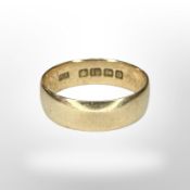 An 18ct yellow gold band ring, size P. CONDITION REPORT: 3.9g.