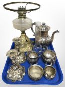 A gilt metal oil lamp base with clear glass reservoir,