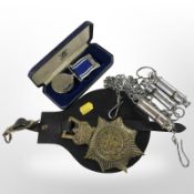 A Police Long Service and Good Conduct medal, together with three whistles,