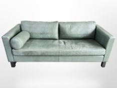 An Illums Bolighus Kollektion three seater settee upholstered in pale turquoise leather with one