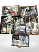 A pallet of ex-retail electricals including optical cables, TV remotes,