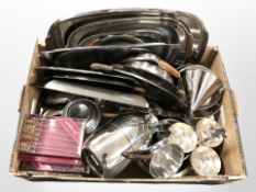 A group of 1970s stainless steel serving platters with teak handles, further silver-plated wares,