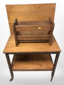 A teak folding trolley and a magazine rack