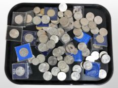 A collection of commemorative crowns and other coins.